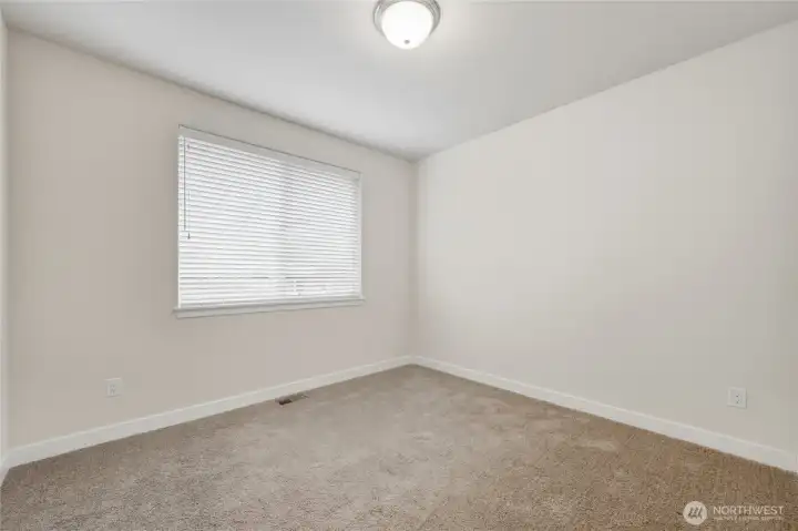 The second main floor bedroom at the front of the house.