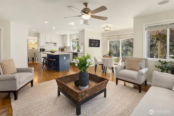 The family room and kitchen areas lead right directly out to the backyard with a stone patio and stunning landscaping.