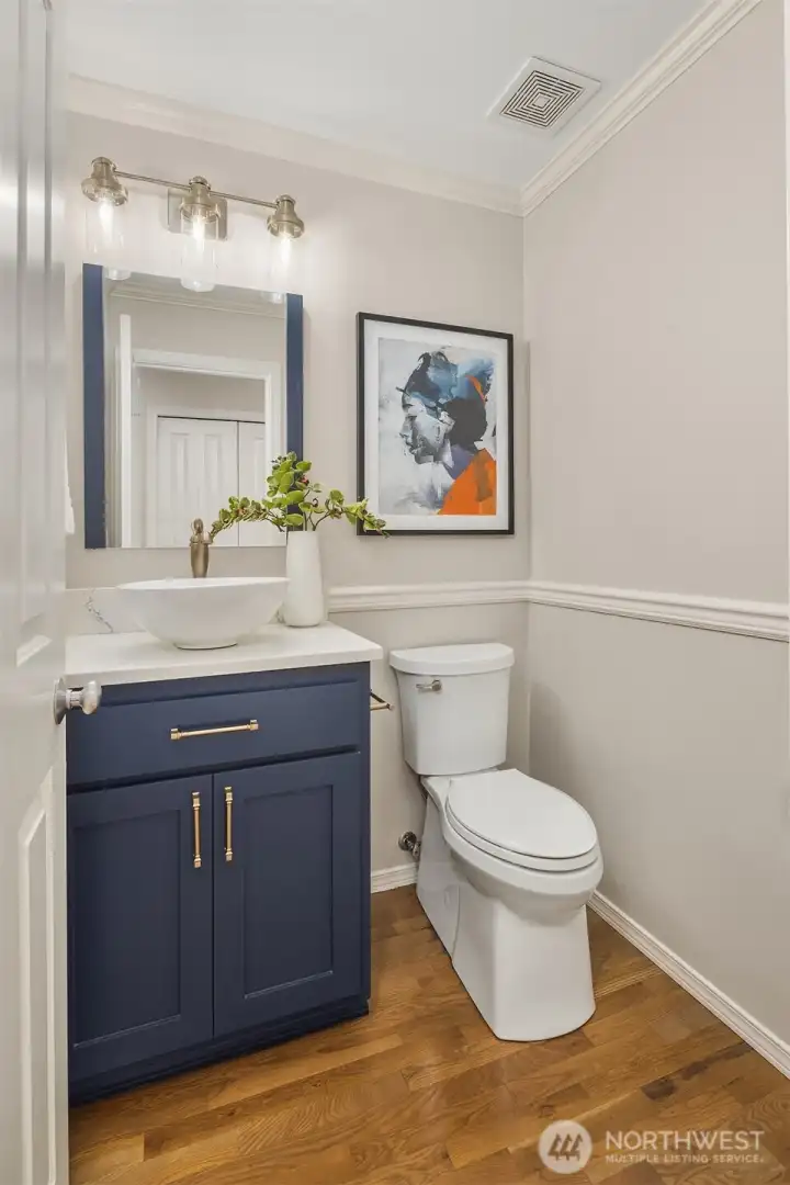 The main floor powder room was recently renovated by the current owners.
