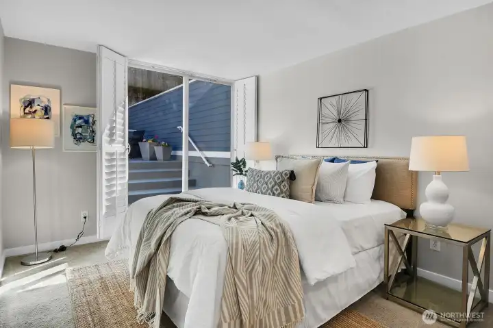 Your private patio is directly outside the sliding glass doors in this primary bedroom.