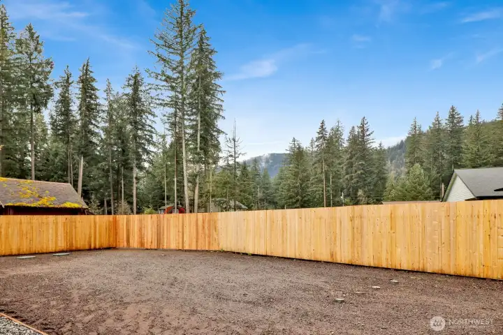 Imagine evenings on the patio, weekend barbecues, and unforgettable moments—all set against breathtaking mountain views in this spacious backyard retreat