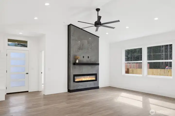 Cozy yet modern living space with beautiful electric fireplace and open layout