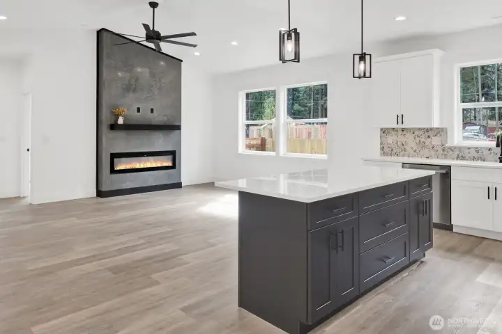 Bright living room with vaulted ceilings and abundant natural light