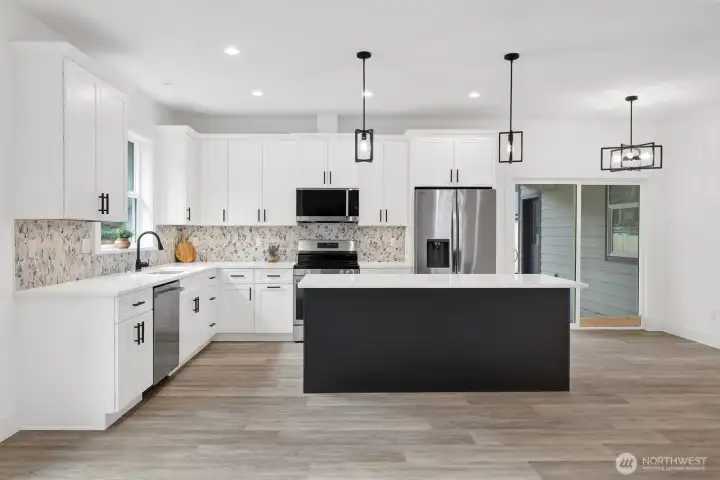 Kitchen seamlessly connected to living and dining areas