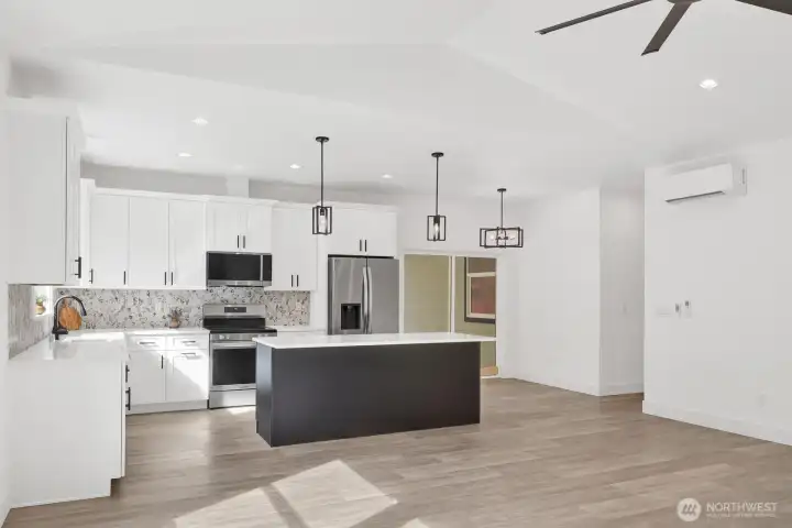 Kitchen seamlessly connected to living and dining areas