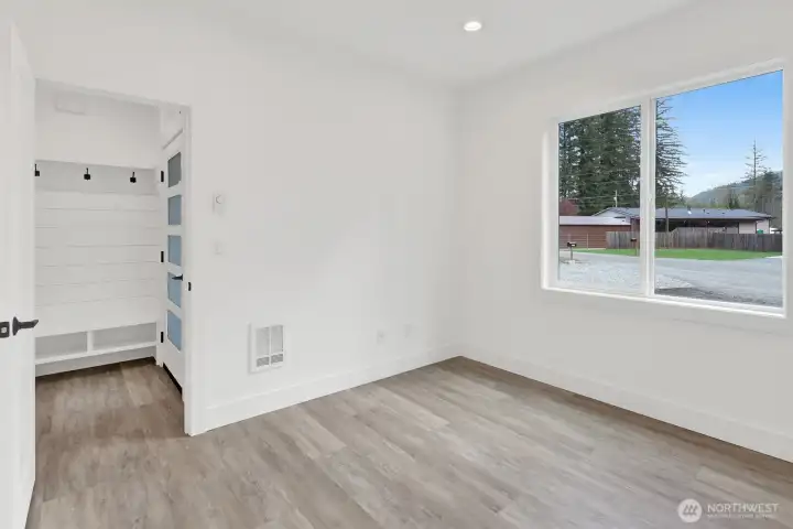 Versatile office space next to the entry way,  perfect for remote work or guest room