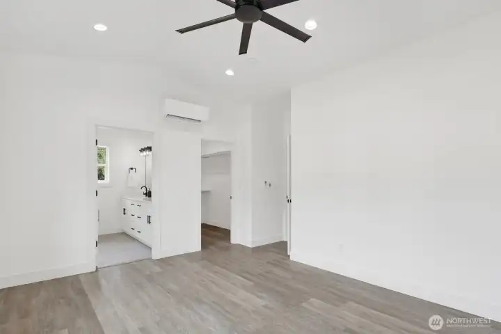 Primary bedroom with walk-in closet offering ample storage space