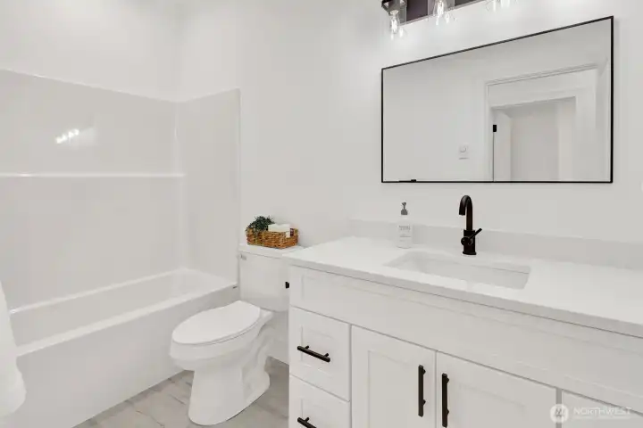Full guest bathroom with clean, modern design