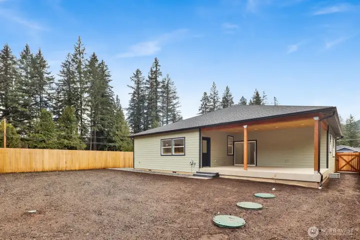 Enjoy wide-open space and stunning mountain views in this backyard—perfect for entertaining, gardening, or simply unwinding
