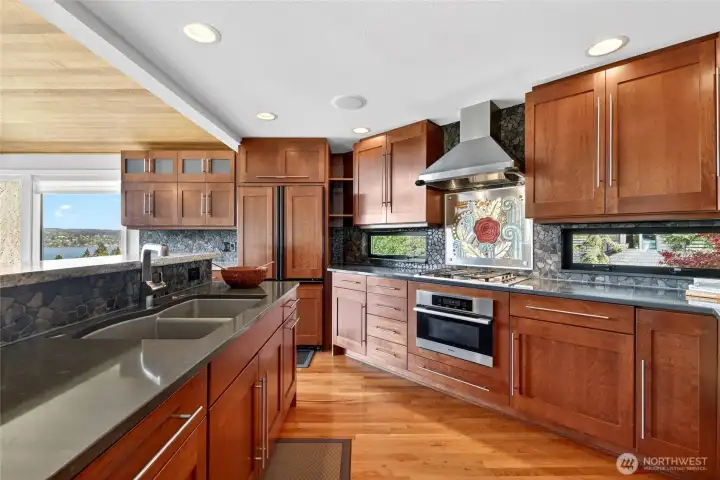 Dramatic quartz countertops, panelized refrigerator doors. Style and function.