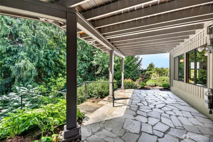 Gorgeous patios and landscaping punctuate this property.
