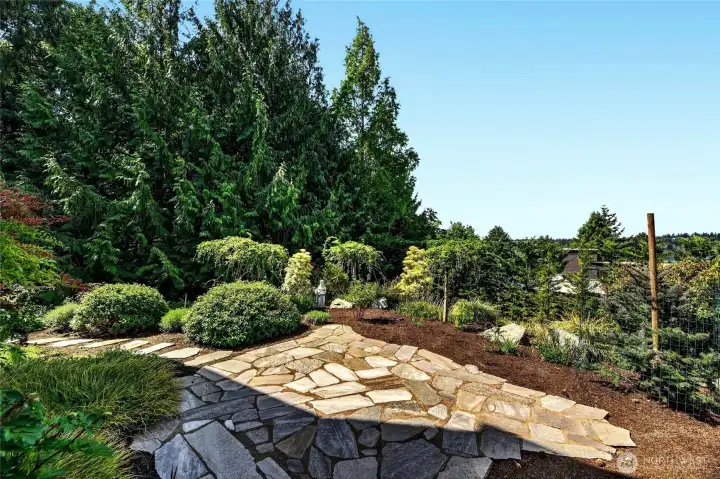 A secret patio with 4 season plantings.