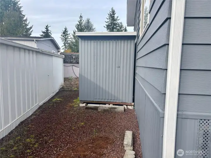 Back of home another storage shed Back of home another storage shed