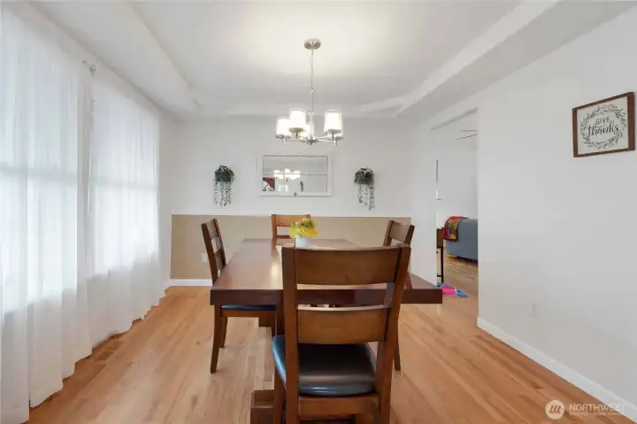 Dining room off front of home and access to the kitchen/living space.