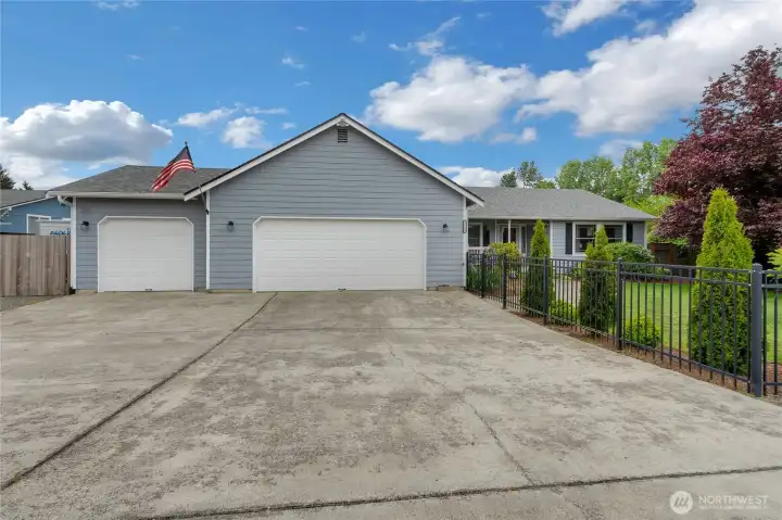 Ample parking in driveway and garage space.