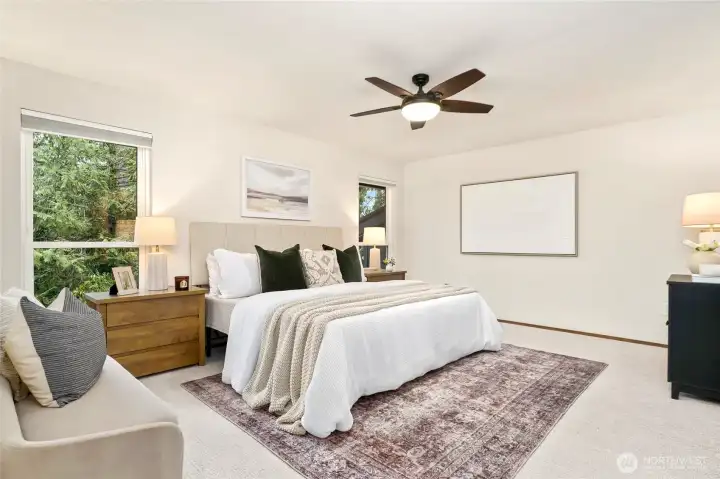 Peaceful primary suite with oversized windows that invite in natural light and serene Northwest views. Peaceful primary suite with oversized windows that invite in natural light and serene Northwest views.