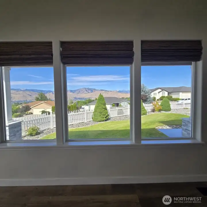 Enjoy Mountain & city views from the living room.  Lots of natural light!
