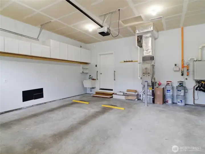 2 car garage with storage and utility sink.