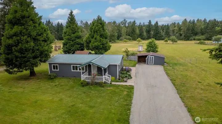 Drone view of the front of this Amazing home and property.2.5 fully fenced acres.