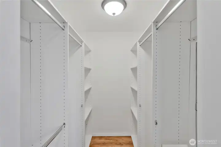 Walk in closet in primary bedroom