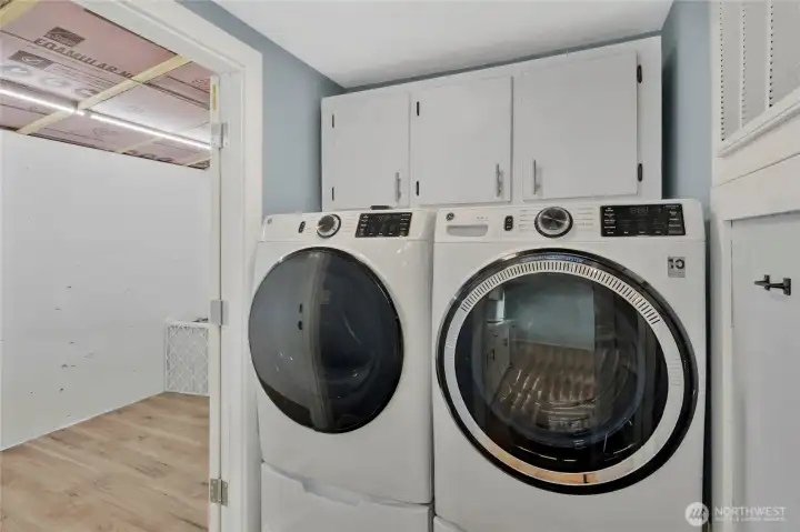 Laundry room with washer and dryer that stays with the house