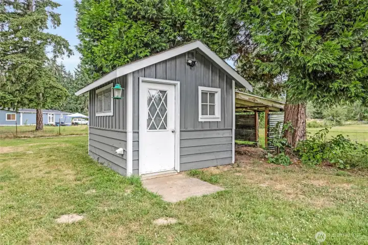 Outbuilding for storage.Chicken coop is to the immediate right