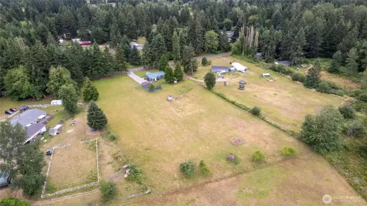 Drone shot showing from the rear of the property looking back towards the house