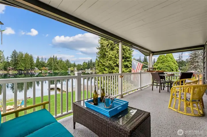Discover a rare chance to live on Lake Lucerne, a community known for peaceful water, abundant wildlife, and year-round outdoor enjoyment. This covered main floor deck is the perfect place to relax or share a meal. This home captures the essence of Northwest lake living.