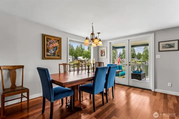 Because it opens directly to the covered deck through French doors, the dining room becomes a true indoor-outdoor gathering space, perfect for entertaining, or simply enjoying the beauty of the lake.