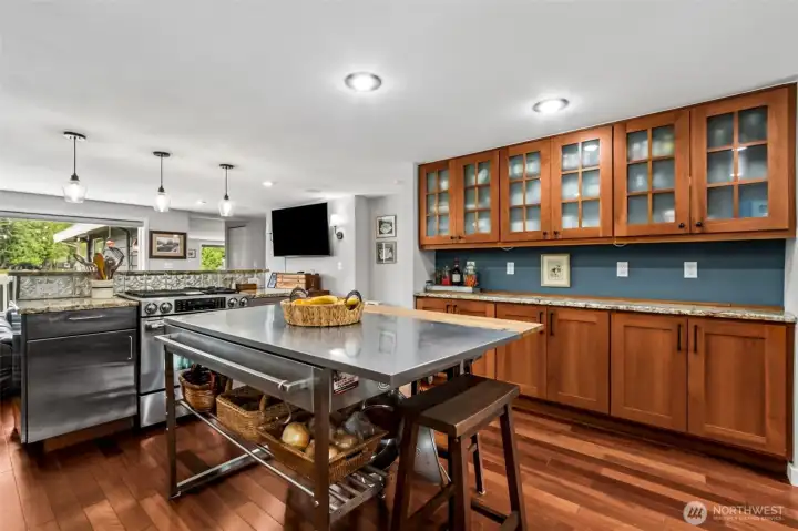 The remodeled kitchen features stainless steel appliances and generous cabinetry that support both everyday cooking and entertaining. Its layout keeps the lake in view while you work. It’s a functional and stylish centerpiece of the main floor.
