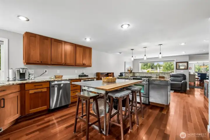 The remodeled kitchen is one of those spaces that feels both beautifully finished and genuinely functional. The  gentle, easy flow makes the home feel welcoming from the moment you step inside. Each space connects naturally to the next, allowing the living room, dining room, and kitchen to function as one cohesive area without losing their individual character. The layout enhances everyday comfort and creates a seamless backdrop for entertaining, all while keeping the lake in view throughout the main level.