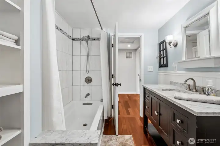 Main floor full bath, with easy accessibility to all three main floor bedrooms.