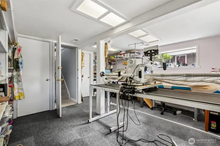 The lower level bonus room is used here as a quilting studio. What might you use this space for?