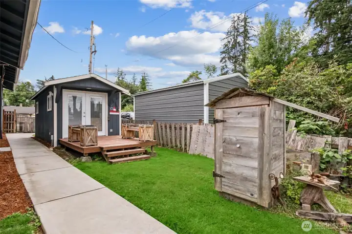 Once inside the gate the yard is fully fenced. The pottery studio adds charm and potential to the property. Whether used for storage or creativity, it’s a unique bonus. Additionally, this smoker is perfect for the trout you can catch in the lake!