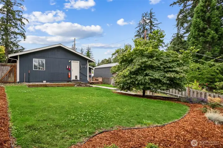 The level yard just past the garage/shop. Room to garden?