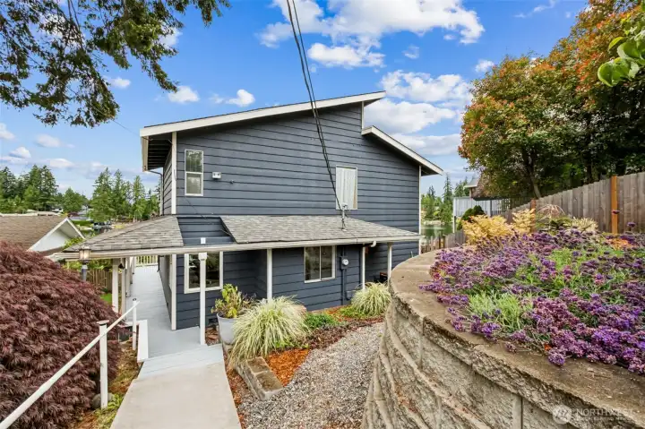 The walkway to the house creates a beautiful moment where the lake slowly reveals itself as you approach.  It’s  welcoming approach sets the tone for the entire property, giving you that unmistakable feeling of arriving somewhere peaceful and special.