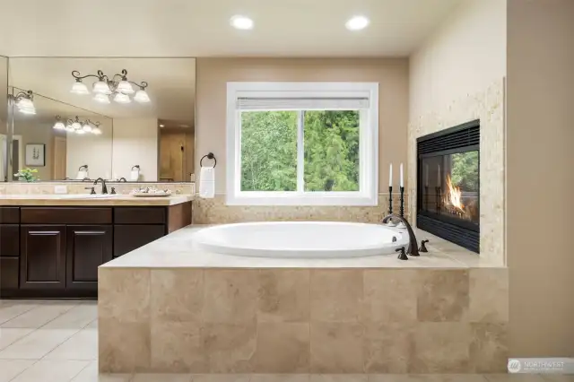 Enjoy the warmth from the Fireplace while soaking in this large tub.