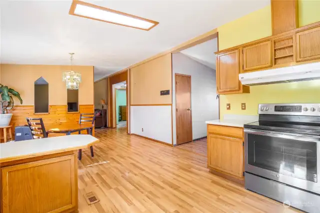 Here we are in the kitchen, facing the dining area, and the living room and entry are to the right.