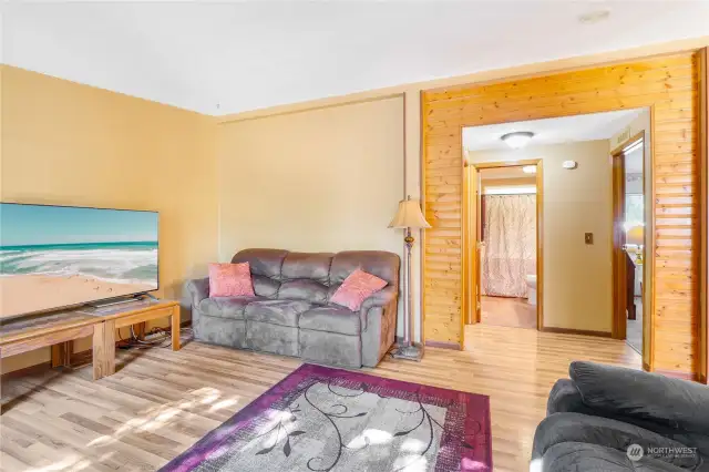 Family room with a view into the main bathroom. It's so bright and spacious in here!