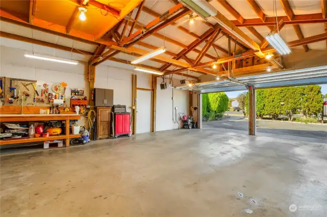 Another view of the shop/two-car garage.  The work bench goes with the home, and there are two different garage door openers on the garage/shop.