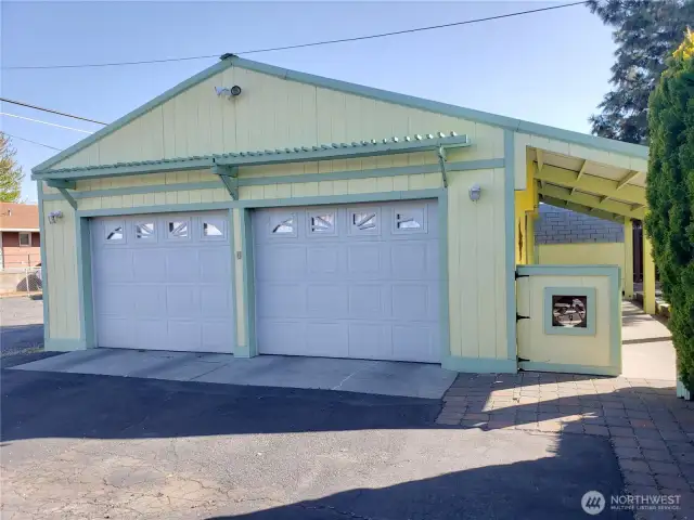 There are two heavy duty gates to the right of the garage to enter the back yard.