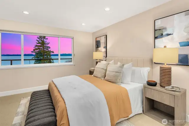 Primary with water views, skyline view, and private access to the outdoor living space.