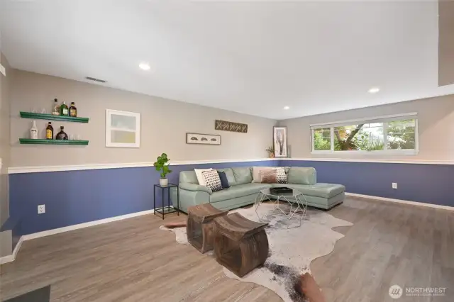 Large recreation room on lower level features a 3/4 bath and access to landscaped backyard.