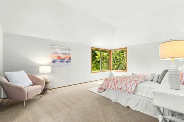 Large primary bedroom with a coved ceiling.