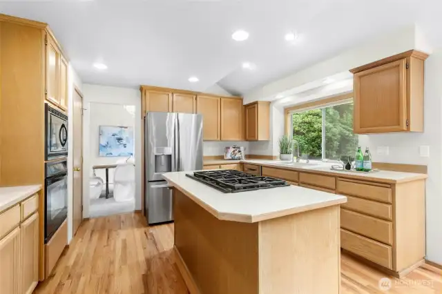 A delightful kitchen, boasting abundant cabinetry, sleek appliances and a pantry.
