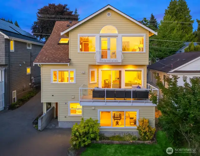 Step into the golden hour. Striking multi-level home in Ravenna with gallery-like views.