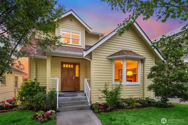 Lush landscaping surrounds home.