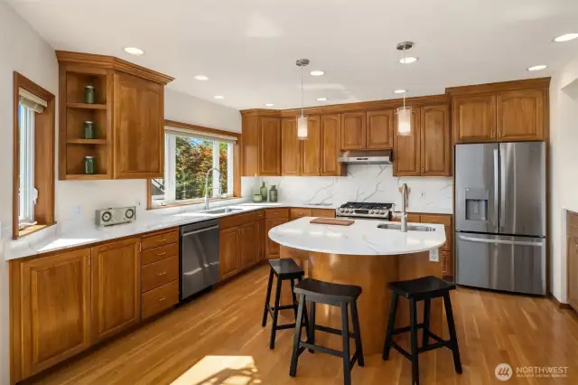 Sleek rounded island is great for combining efficiency and entertaining.