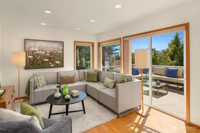 Adjacent to the kitchen, the family room offers an intimate setting for lively chats, where sliding door unlocks a seamless passage to the deck.