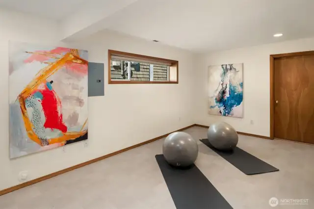 Basement features a flex space. Could be a gym or game room.